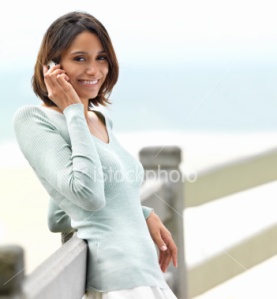 ist2_6198764-smiling-young-woman-talking-on-phone